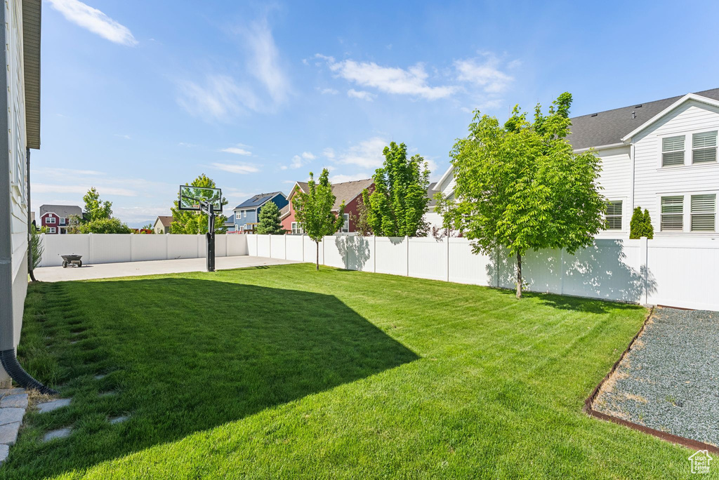 View of yard featuring a residential view and a patio area