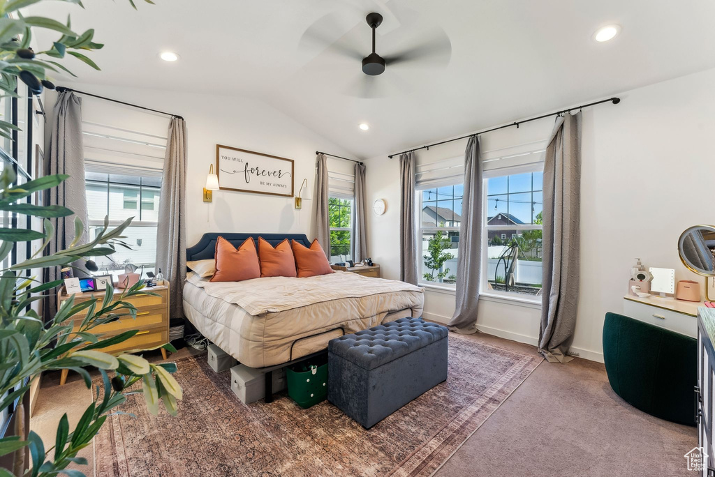 Carpeted bedroom featuring lofted ceiling, recessed lighting, and ceiling fan