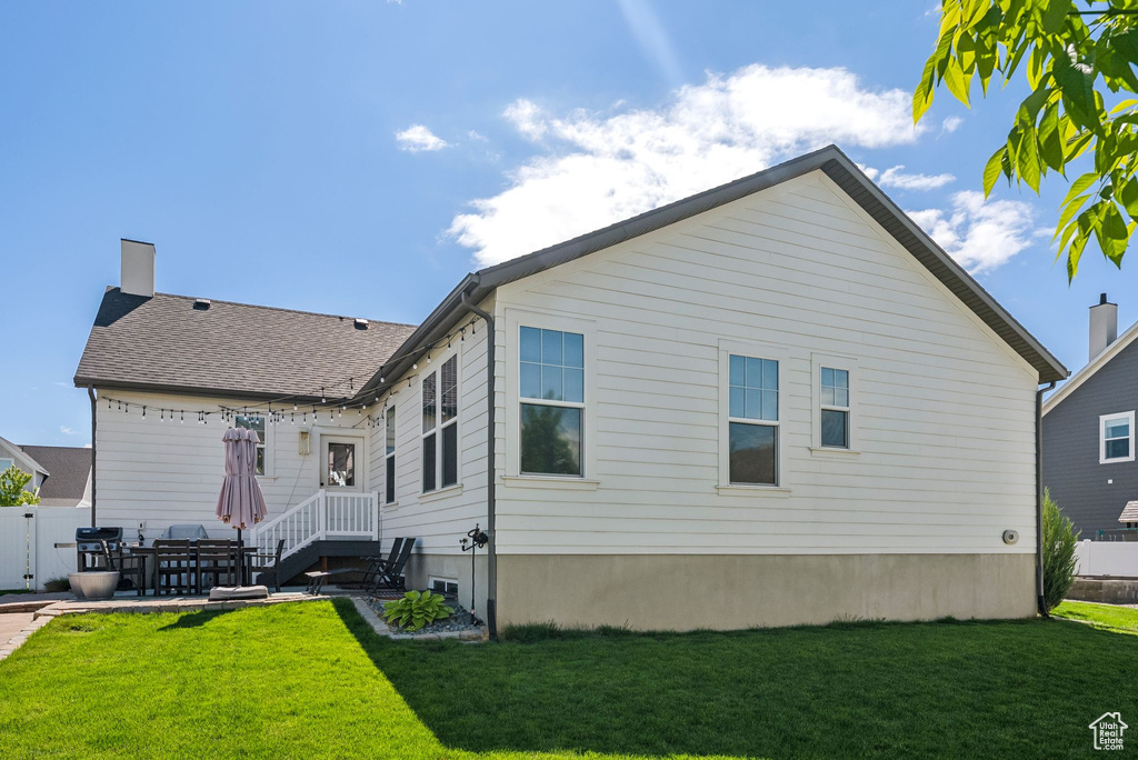 Back of property with a patio