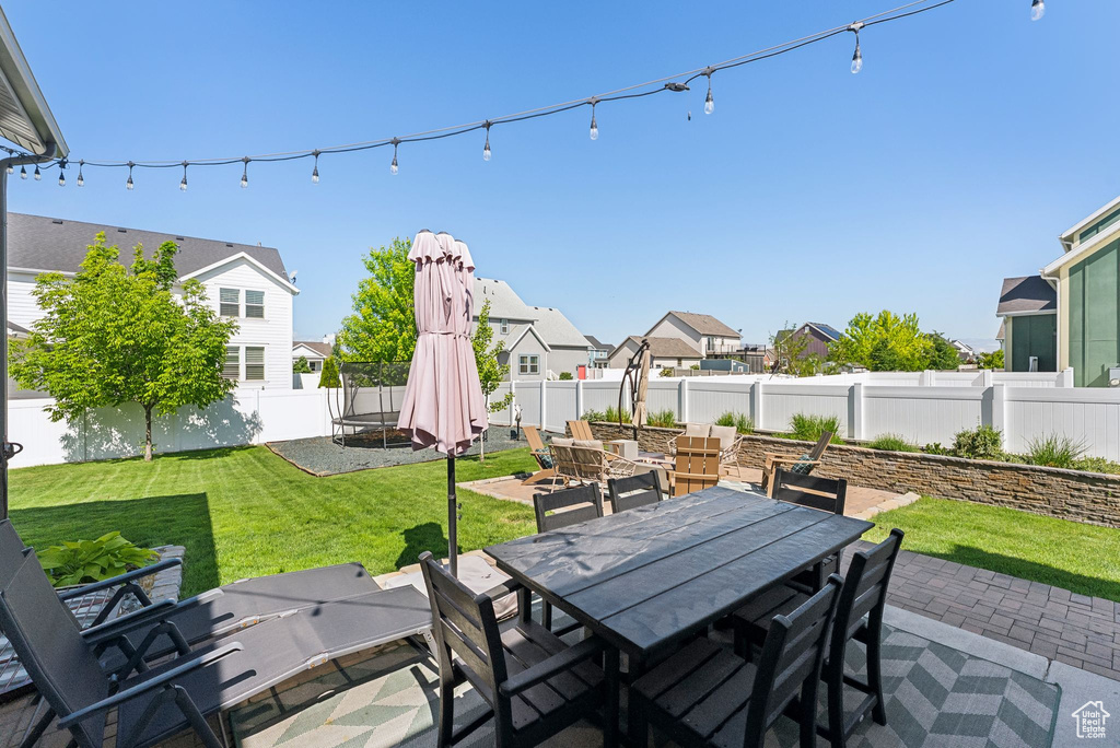View of patio with outdoor dining area and a residential view