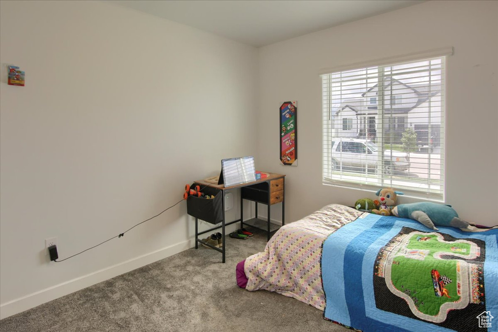 Carpeted bedroom with baseboards