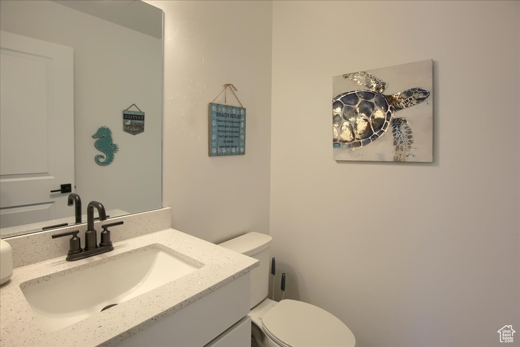 Bathroom featuring toilet and vanity