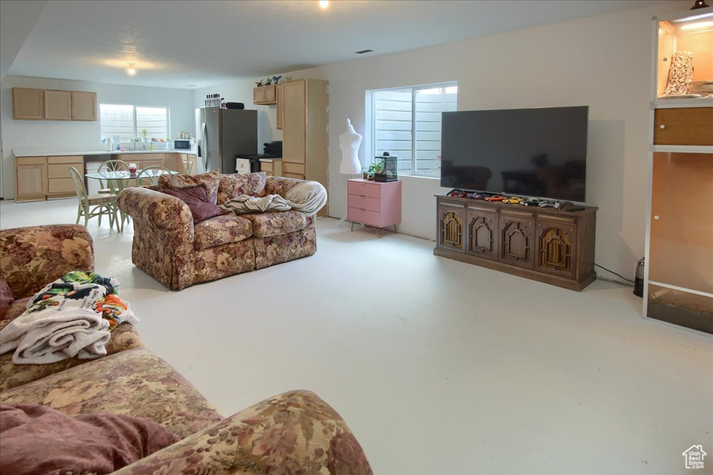 Living area featuring finished concrete flooring