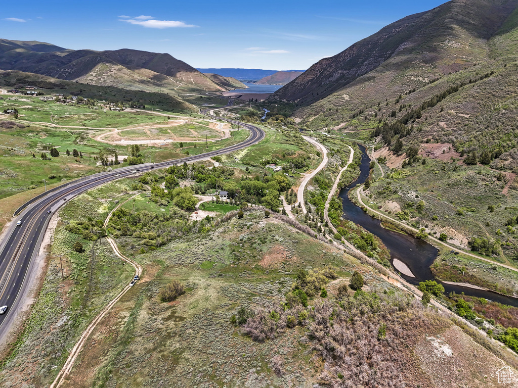 Aerial overview of property's location with a major roadway and mountains