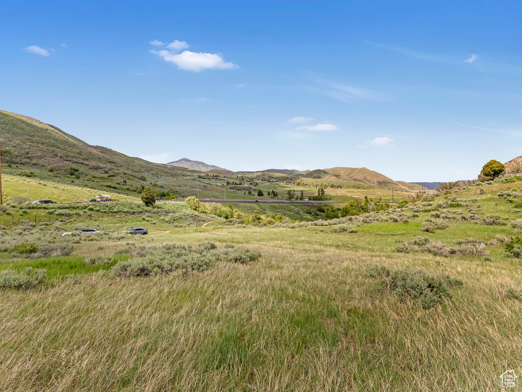 View of mountain backdrop featuring rural landscape
