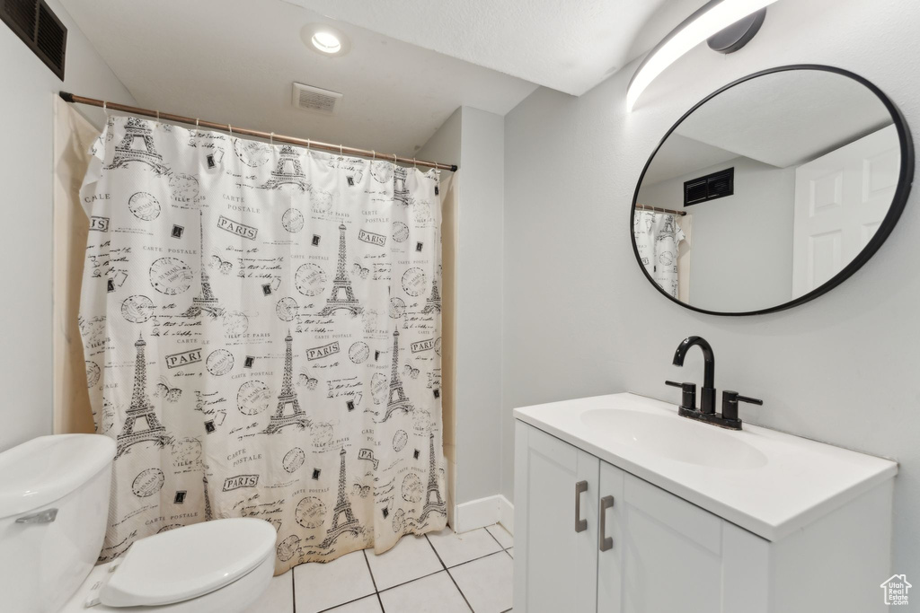 Bathroom with toilet, tile patterned flooring, vanity, a shower with shower curtain, and recessed lighting