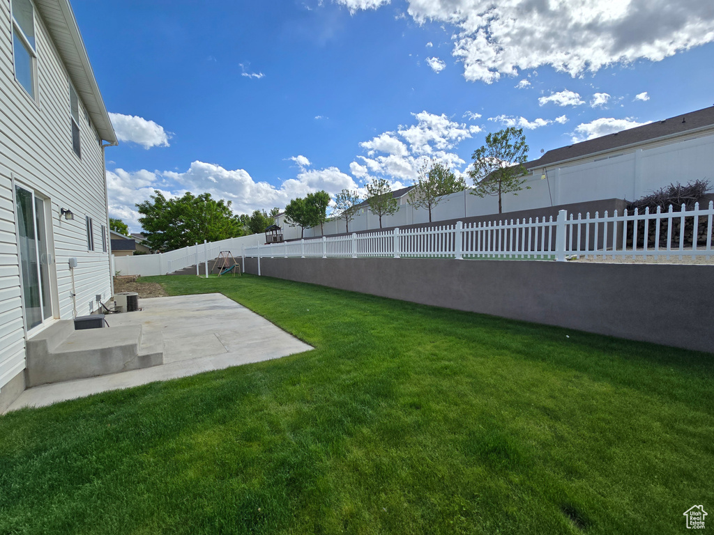 View of yard with a patio