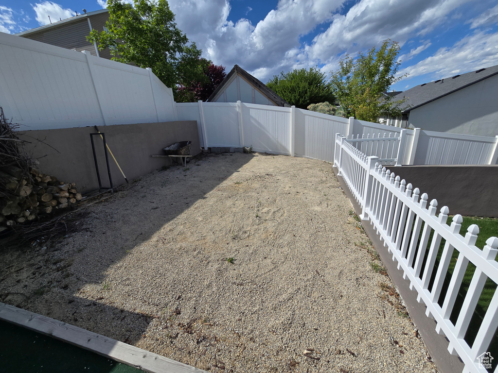View of fenced backyard