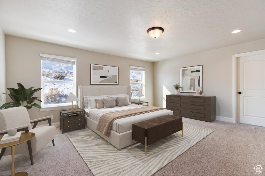 Bedroom featuring light colored carpet, multiple windows, recessed lighting, and baseboards