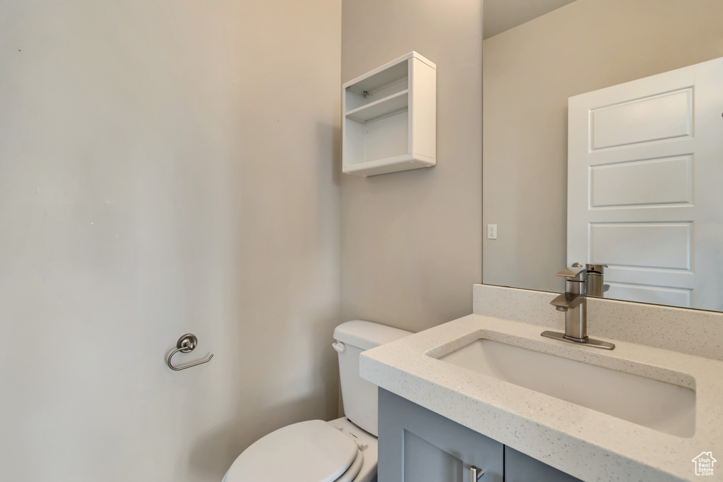 Half bath with toilet and vanity