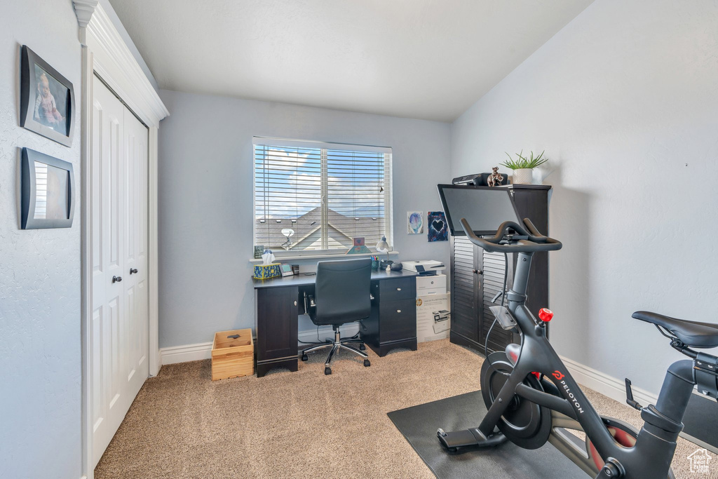 Carpeted office with baseboards