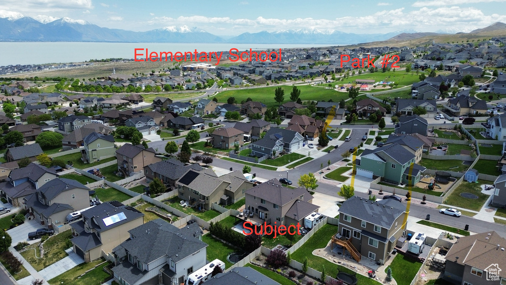 Aerial view of residential area with a water and mountain view