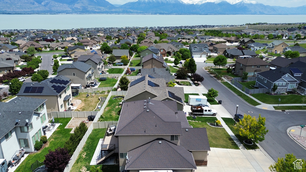 Aerial view of residential area featuring a water and mountain view