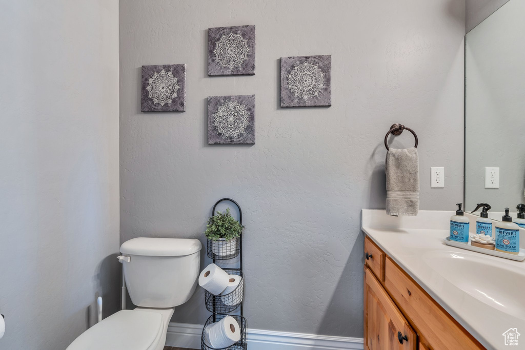 Bathroom featuring toilet and vanity