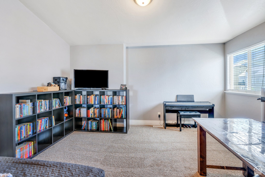Home office with carpet floors and baseboards