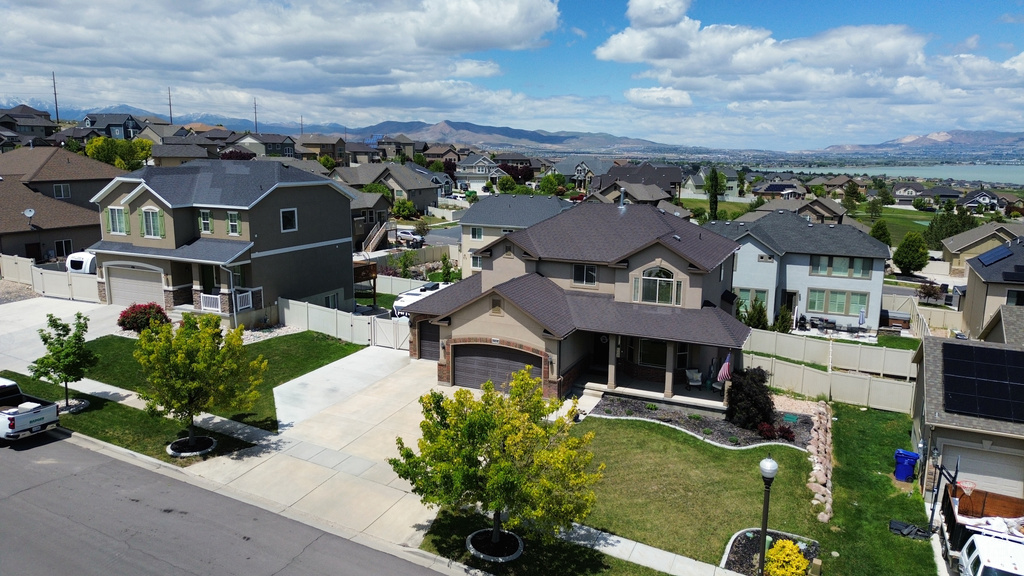 Aerial view of residential area featuring a mountainous background