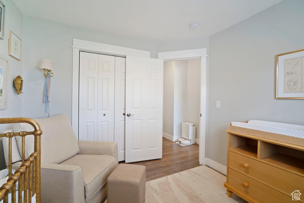 Living area with light wood-style floors and baseboards