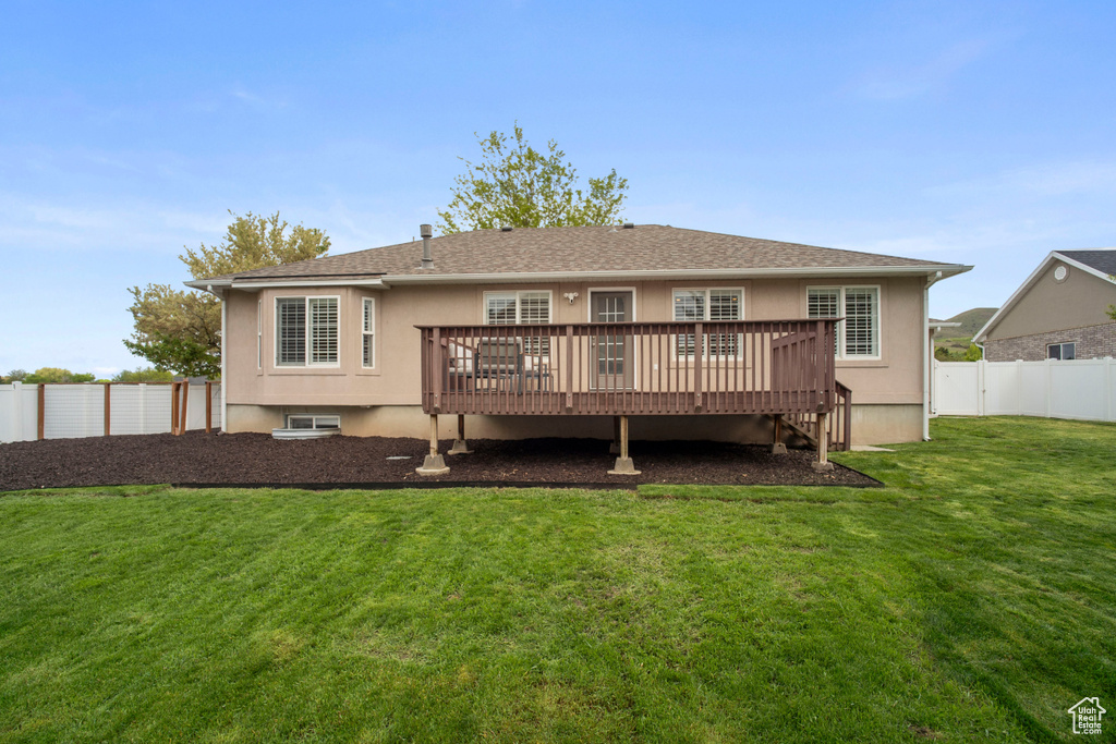 Rear view of property with a wooden deck