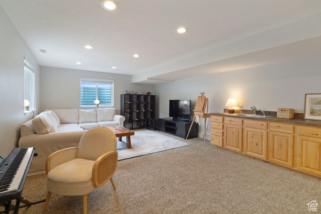 Living room featuring light carpet and recessed lighting