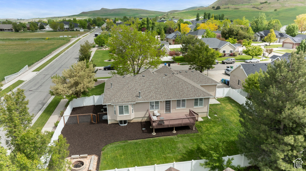 Aerial perspective of suburban area with a mountainous background