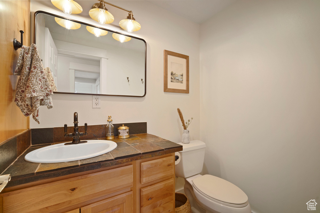 Bathroom with toilet and vanity