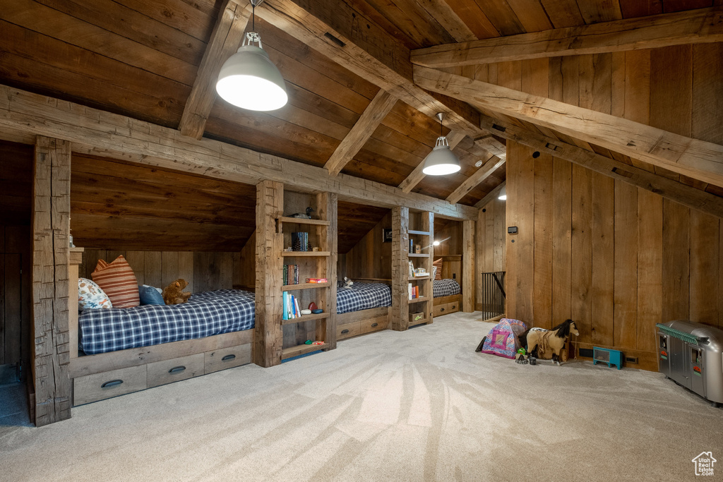 Additional living space with wooden walls, wooden ceiling, and carpet floors