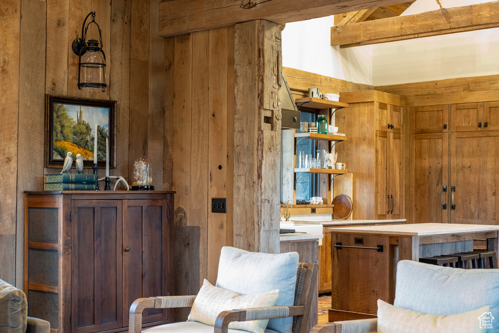 Sitting room featuring wooden walls