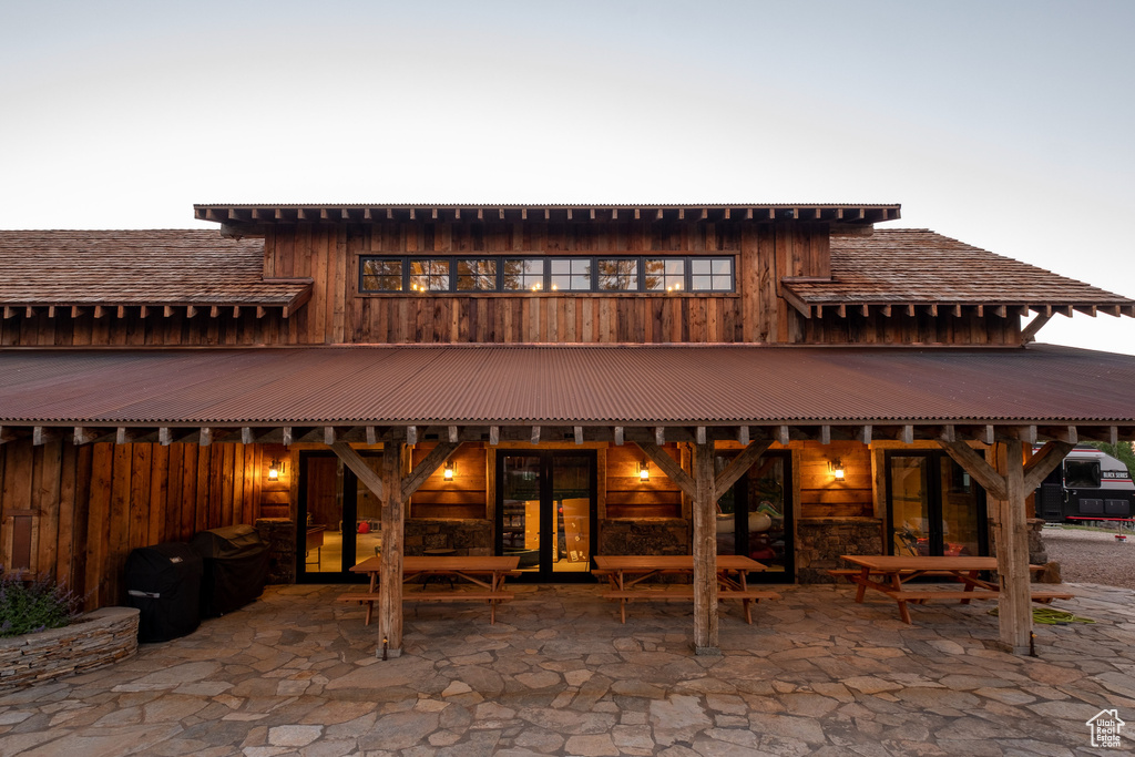 Rear view of property featuring a patio area and fence