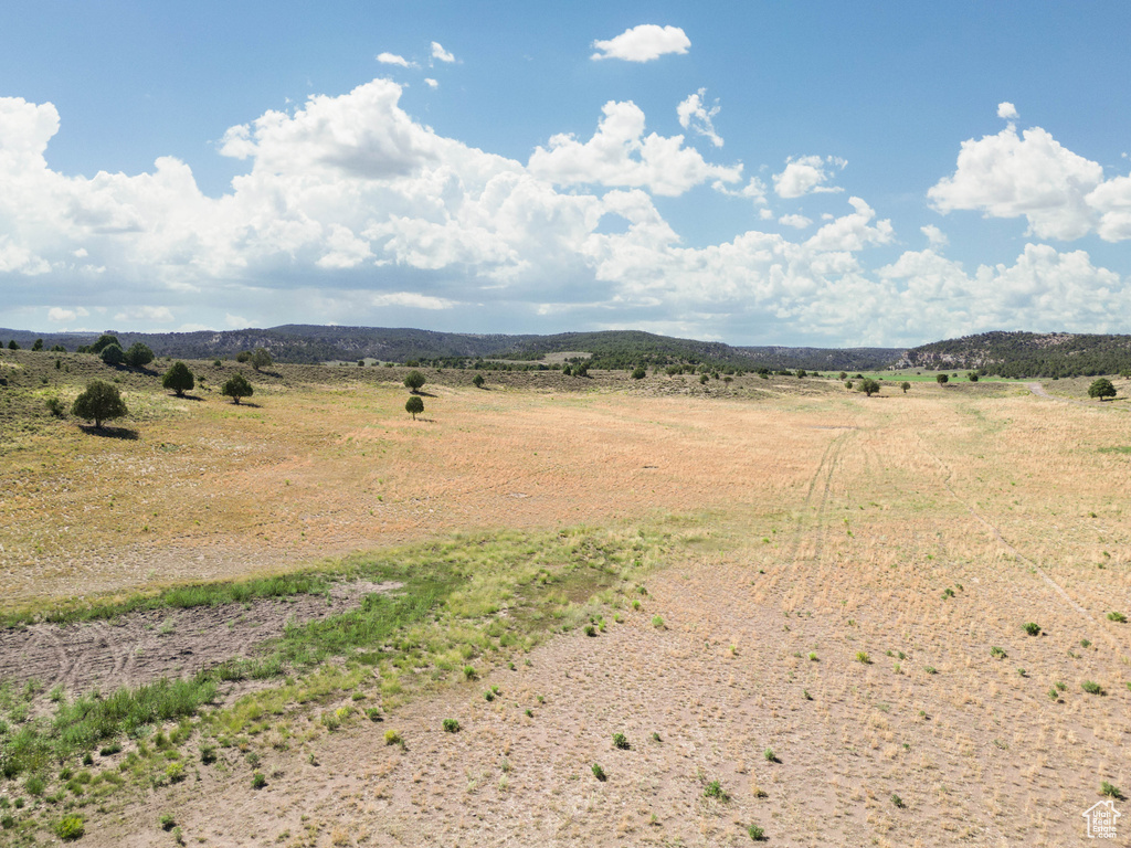 View of mountain background featuring rural landscape