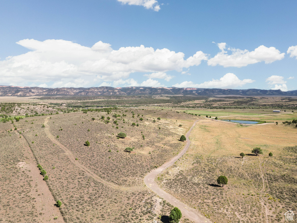 Aerial view of sparsely populated area with a water and mountain view