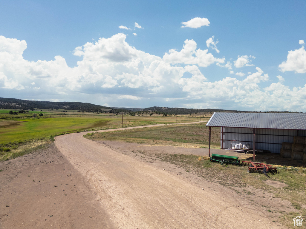 View of road featuring an outbuilding and a view of countryside