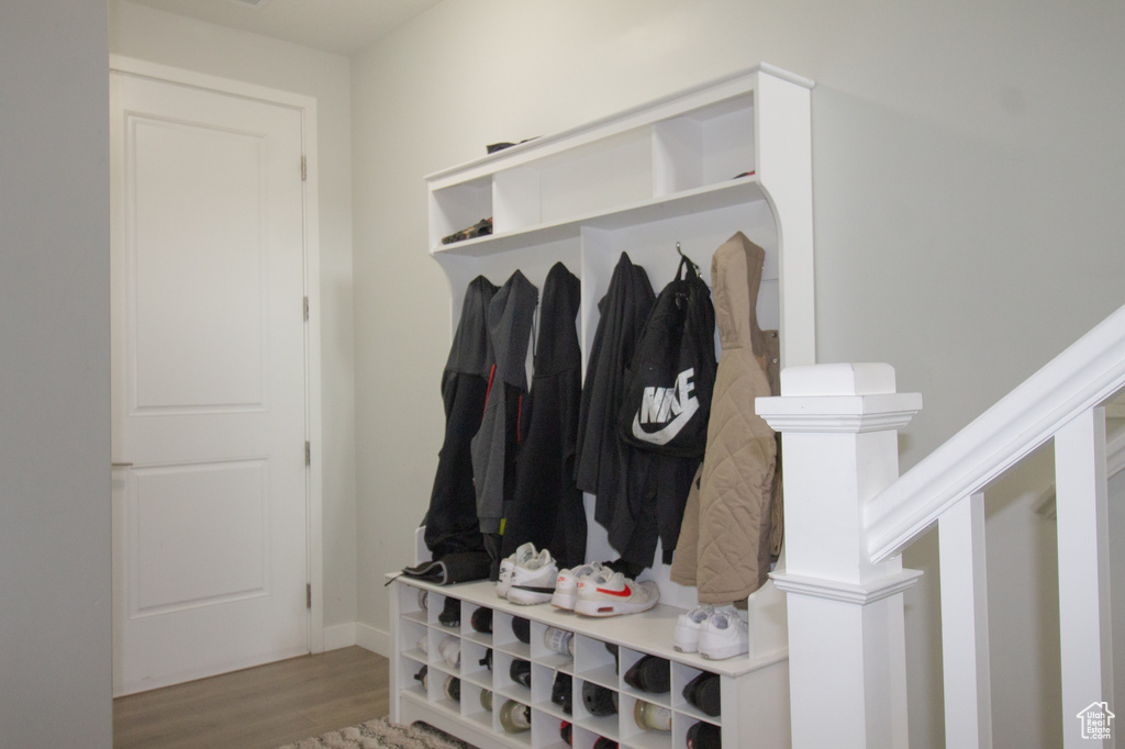 Mudroom featuring wood finished floors and baseboards
