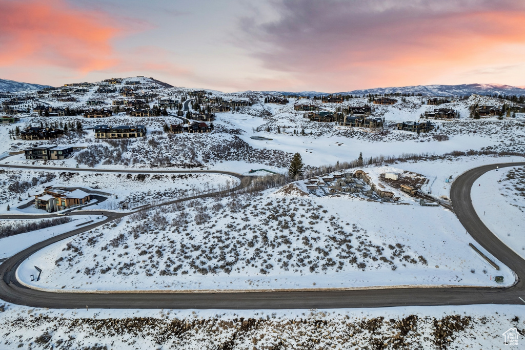 Snowy aerial view featuring a mountain view