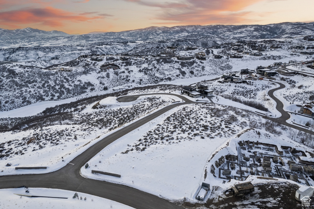 Snowy aerial view featuring a mountain view