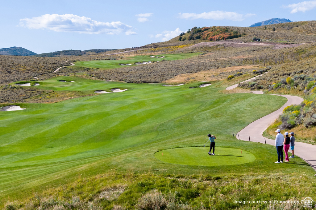 Surrounding community with a mountain view and view of golf course
