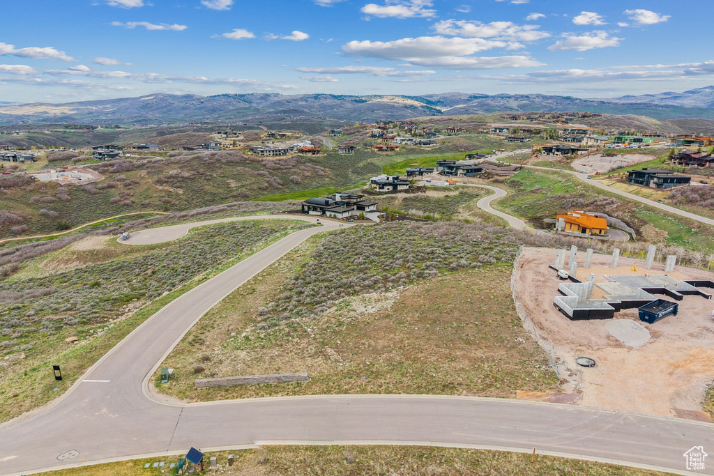 Aerial view of property's location featuring mountains