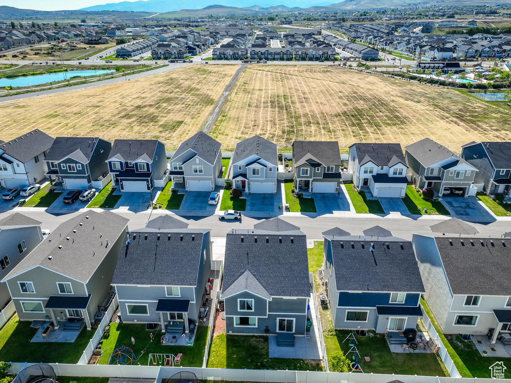 Aerial view of residential area featuring mountains