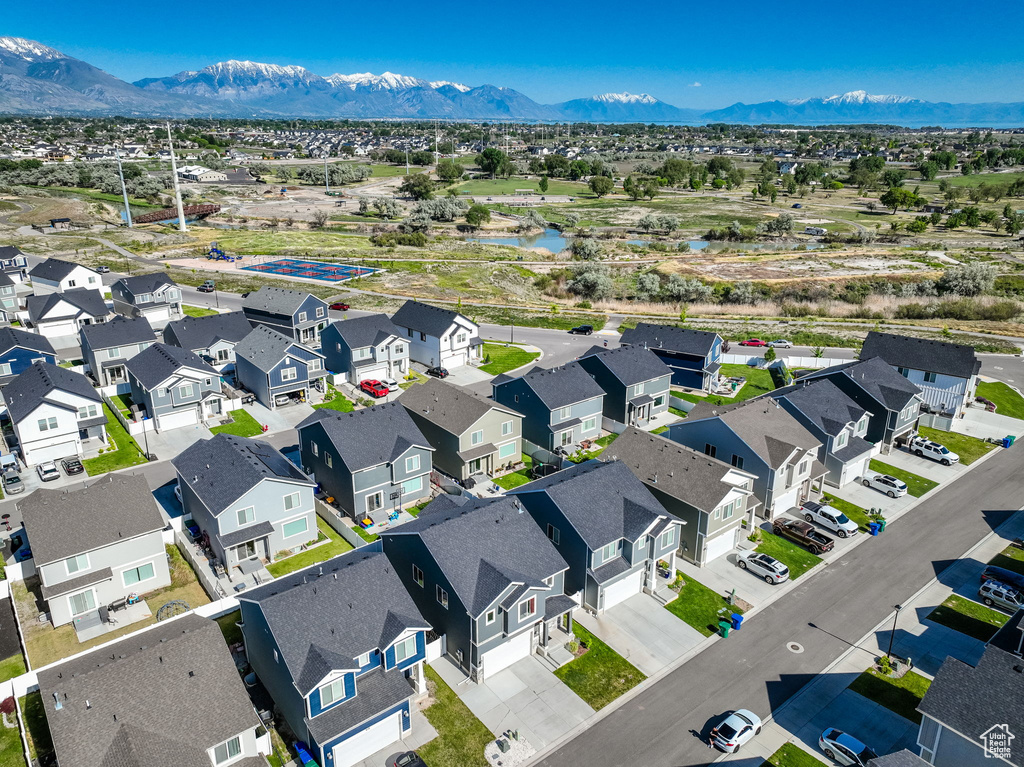 Aerial perspective of suburban area with a water and mountain view