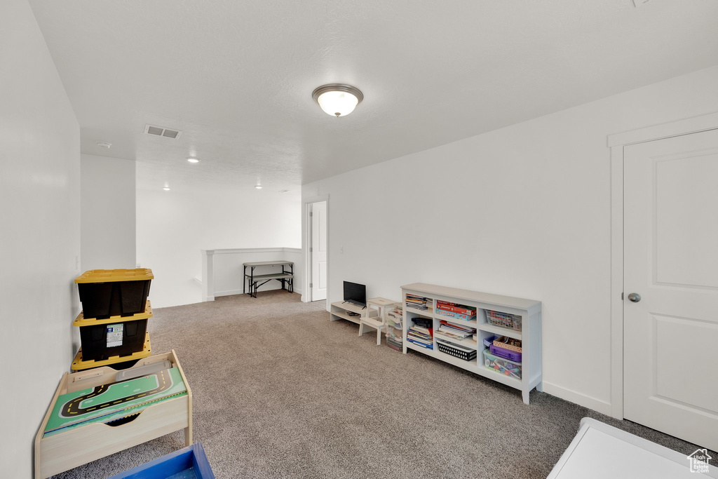 Playroom featuring carpet