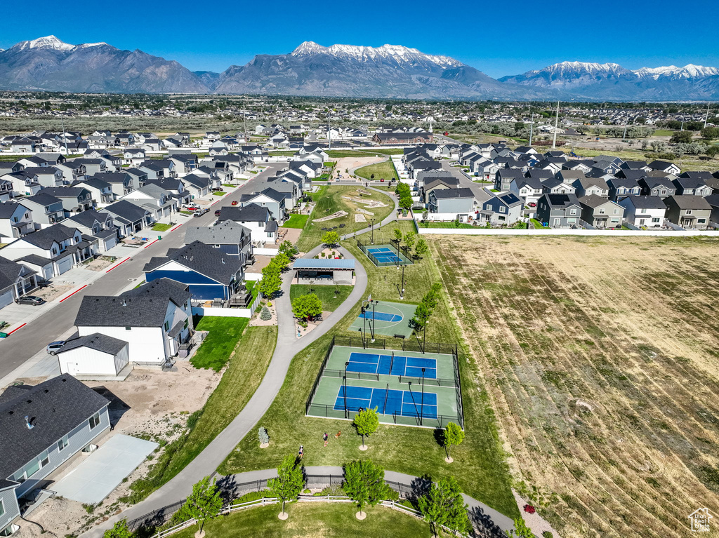 Aerial perspective of suburban area with a mountain backdrop
