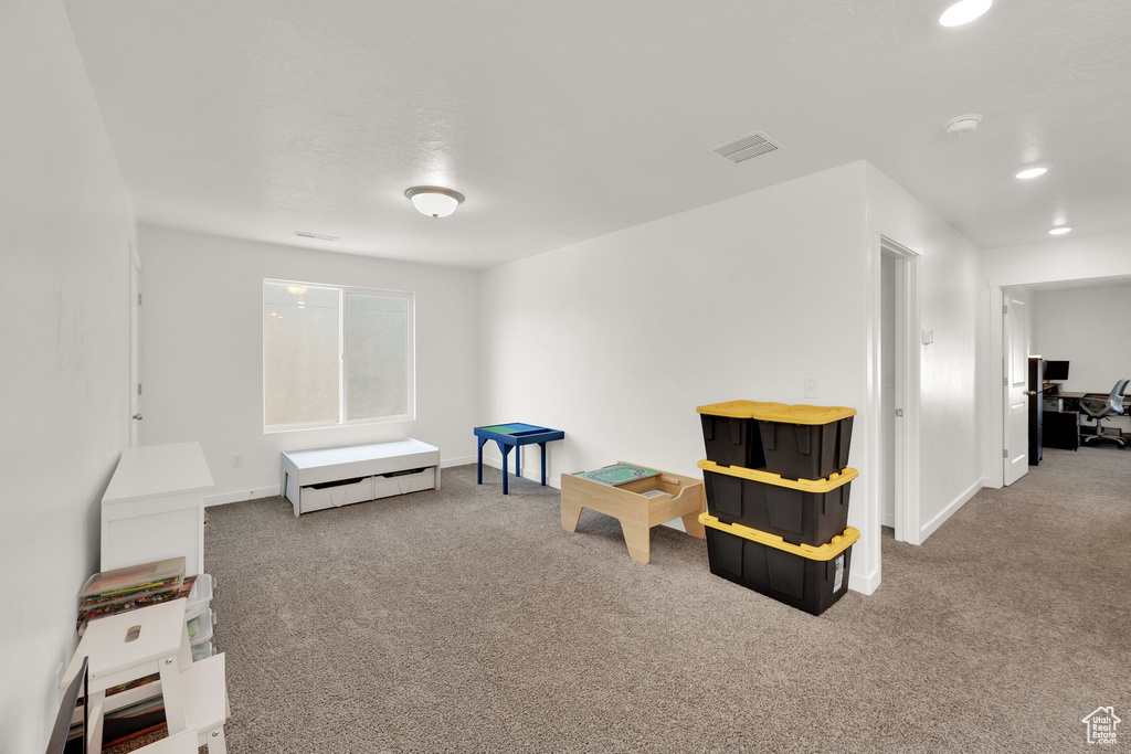 Game room featuring carpet floors, recessed lighting, and baseboards