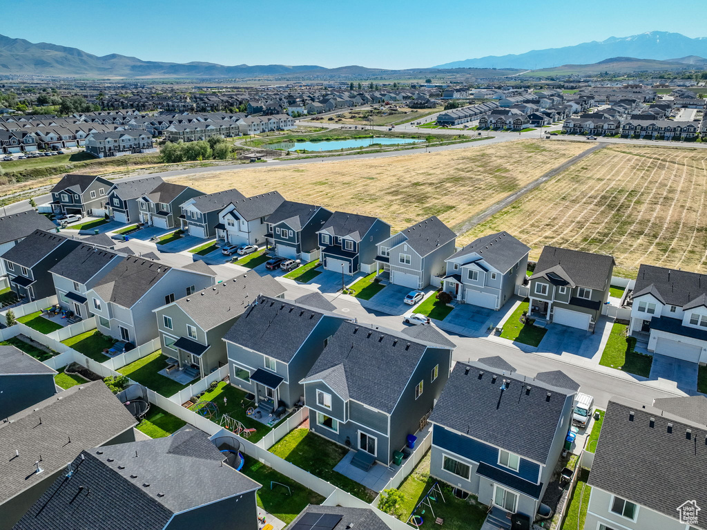 Aerial perspective of suburban area featuring a water and mountain view