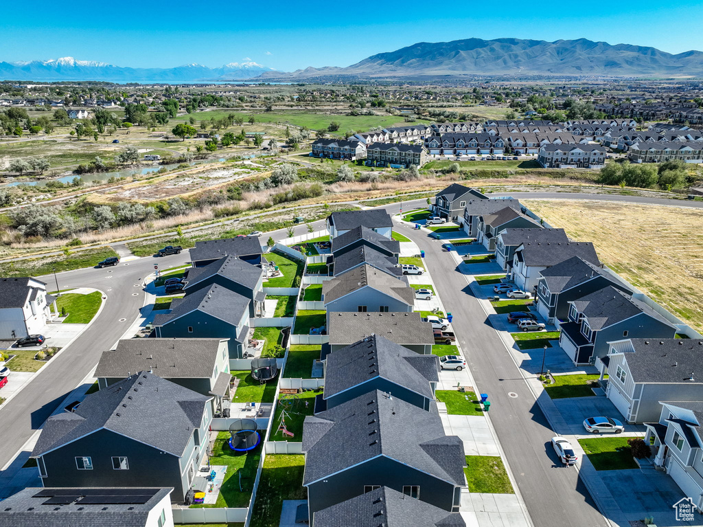 Aerial view of residential area featuring a mountainous background