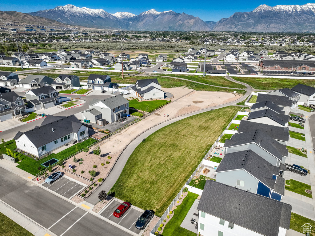 Aerial perspective of suburban area featuring a mountainous background