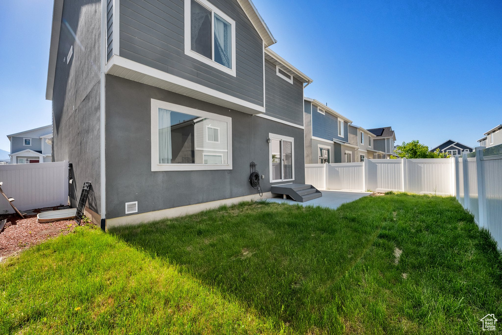Back of property with stucco siding