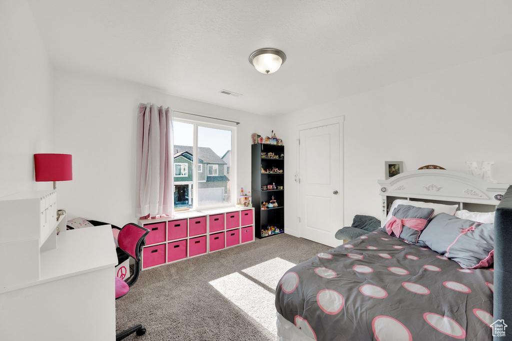 Bedroom with carpet flooring