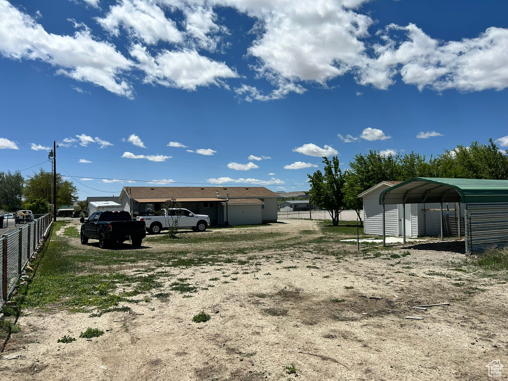 View of yard featuring a detached carport