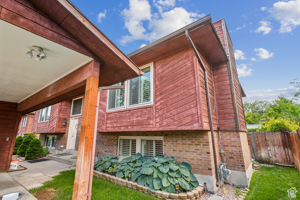 View of property exterior featuring brick siding
