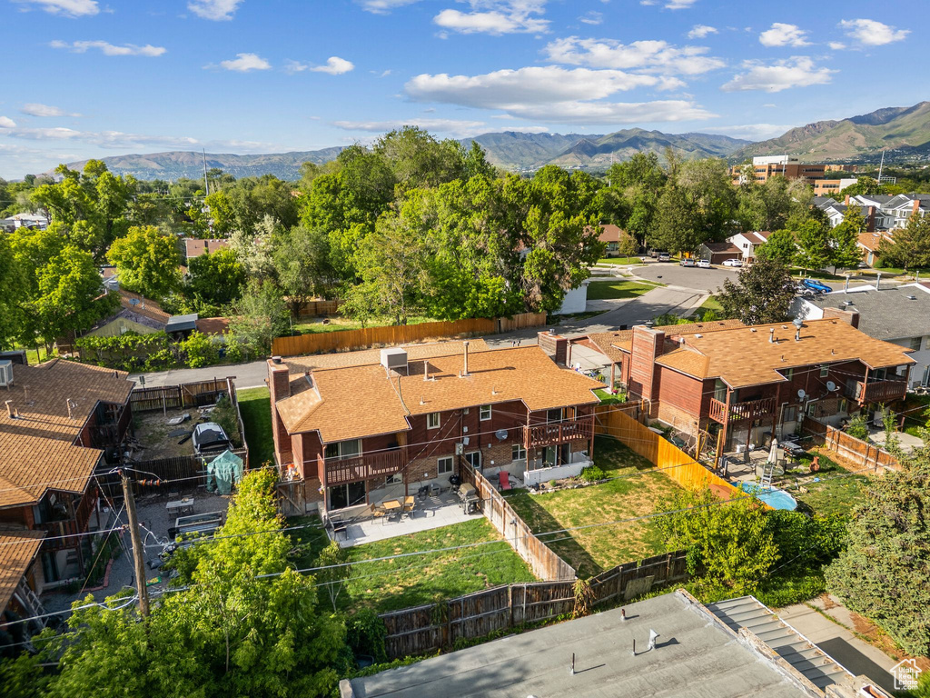 Aerial perspective of suburban area with a mountain backdrop
