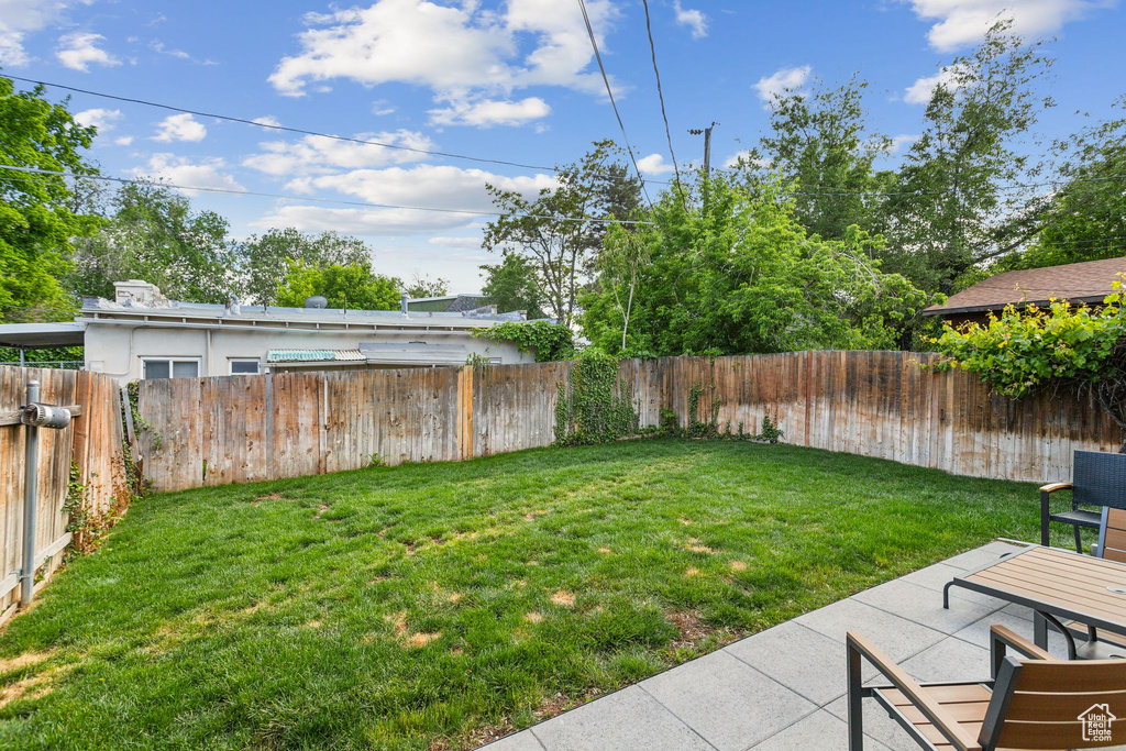 View of yard with a patio area